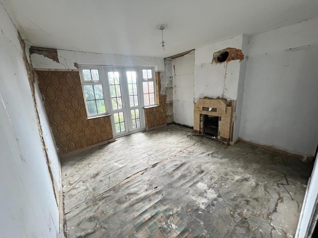 Lot: 139 - HOUSE FOR REFURBISHMENT AND RENOVATION - Reception room with window and door to rear aspect